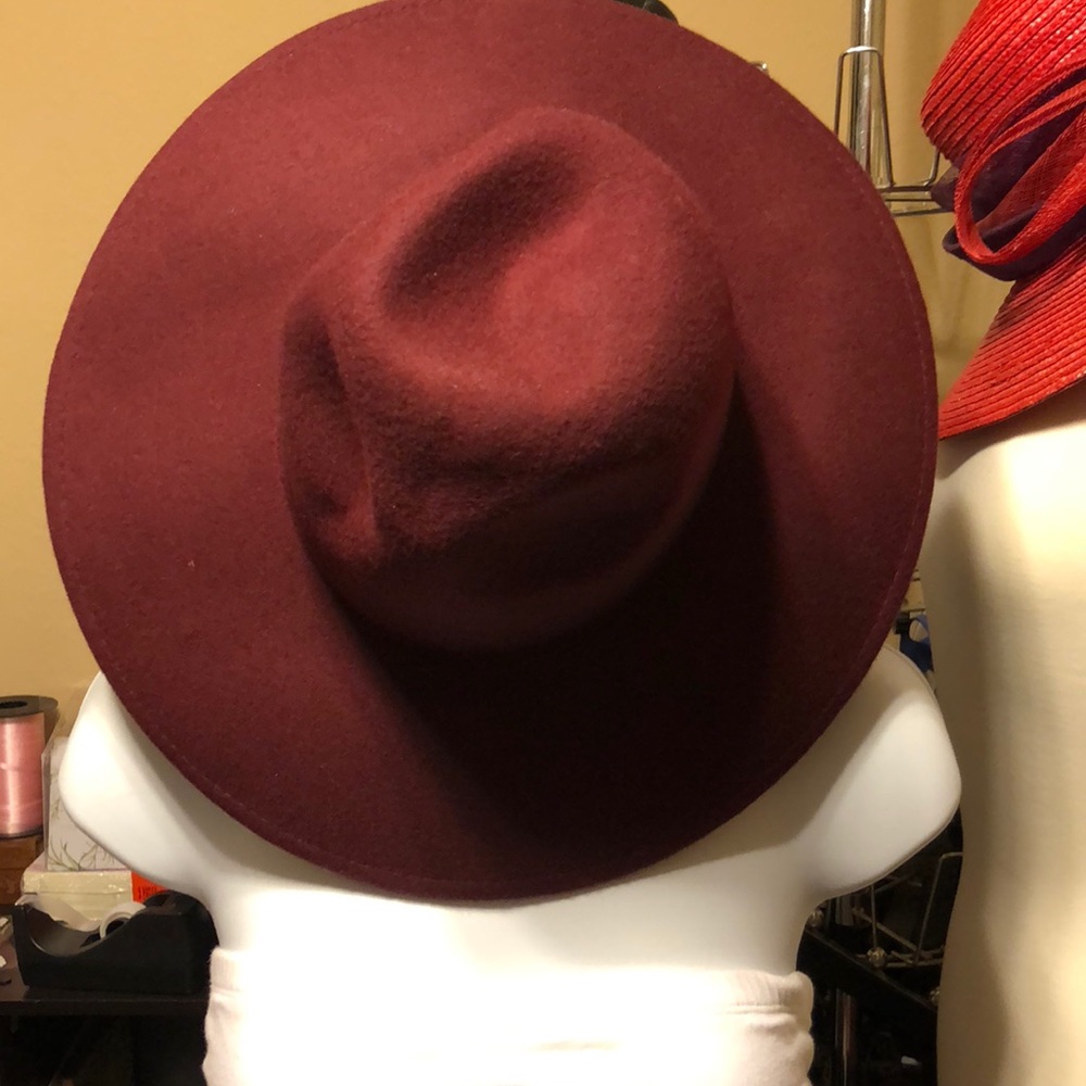 Burgundy fedora style hat.